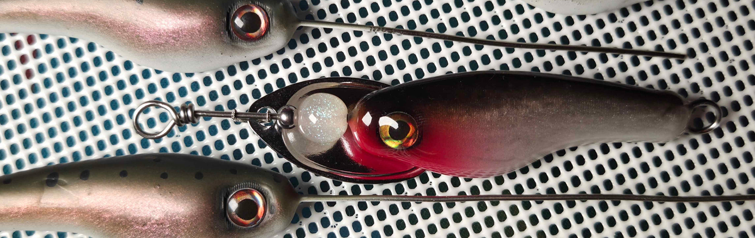 Muotka Lures Spinners in on a silicone net ready for clear coating